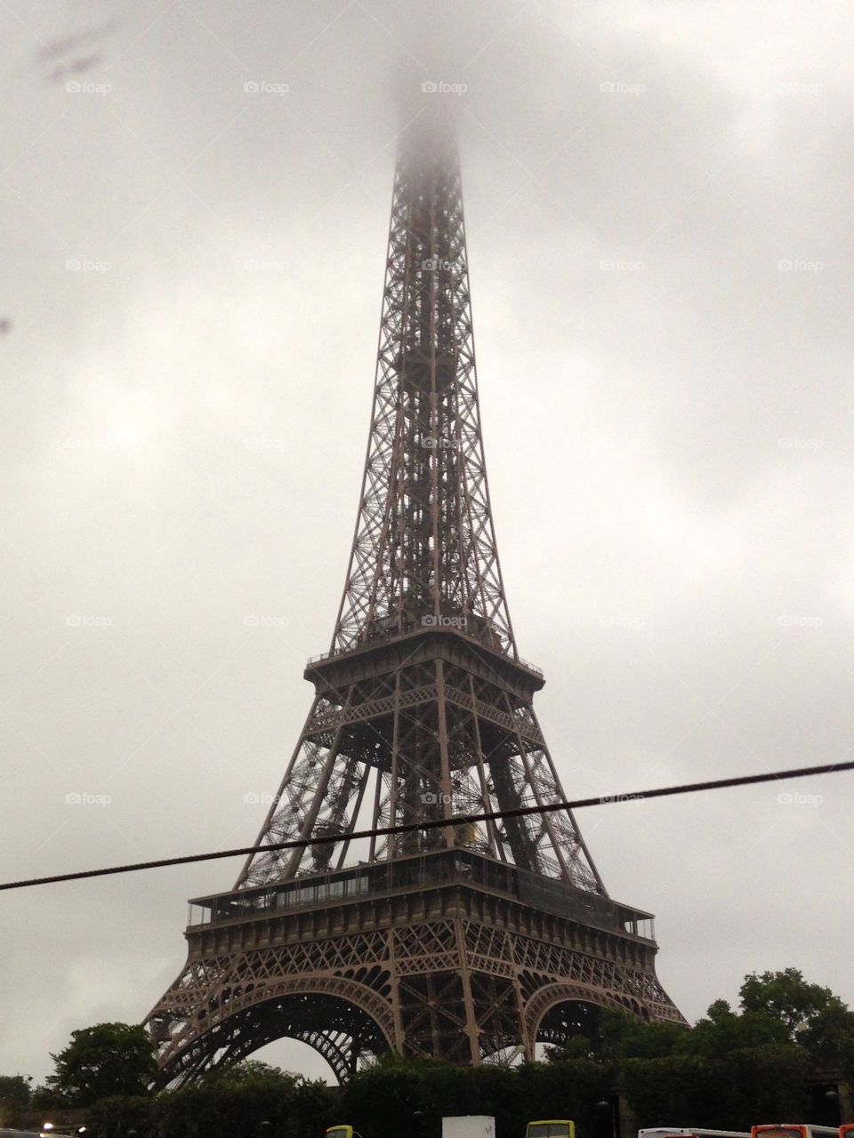 Eiffel Tower in the morning fog 
