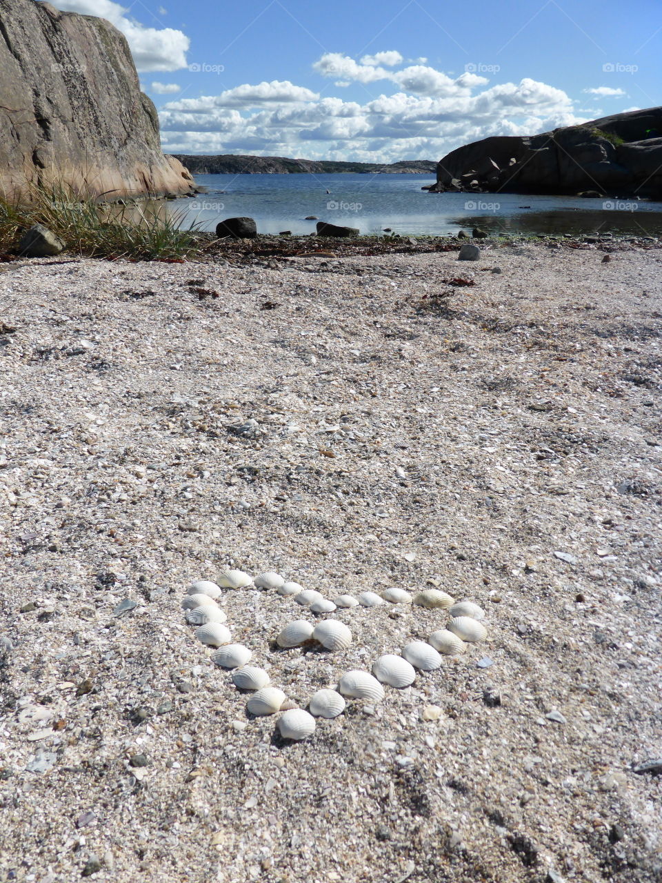 Seashell heart on the beach