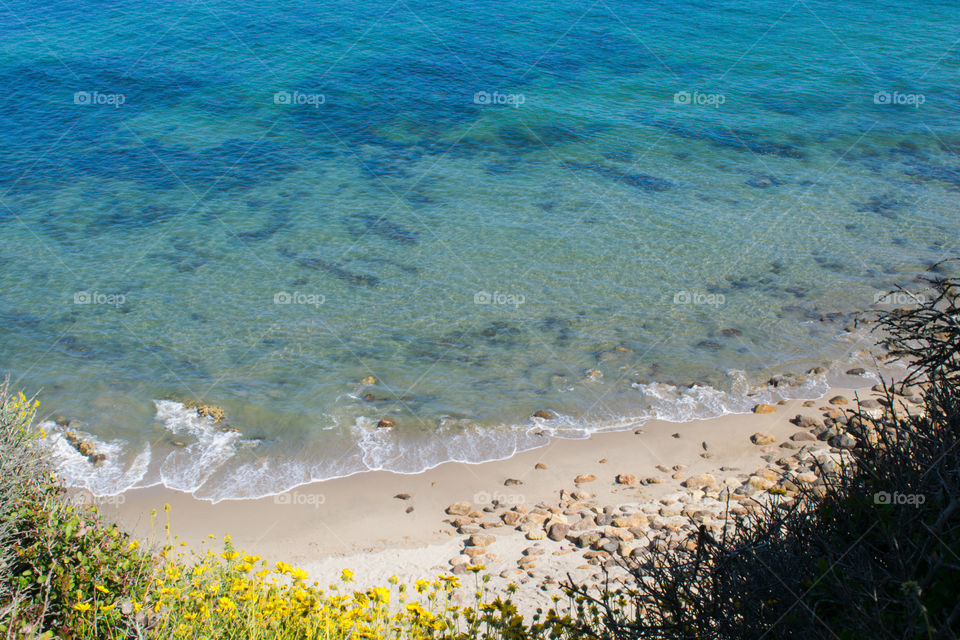 Turquoise Hidden beach In Malibu, California.