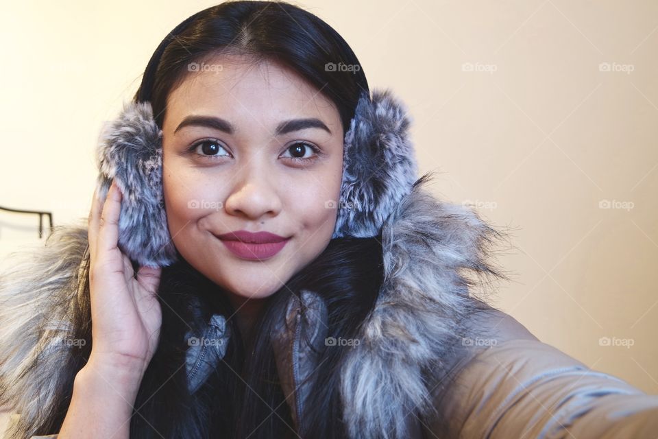 Portrait of woman wearing earmuffs