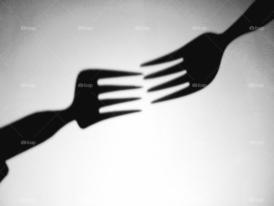 fork shadow on the wall.