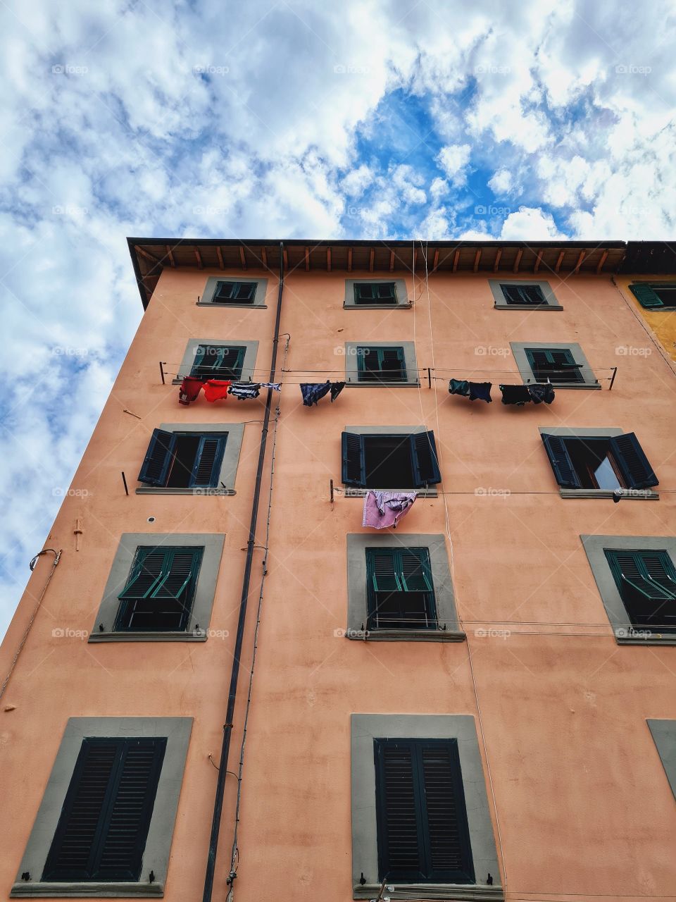 detail of building with clothes hanging(Livorno, Tuscany)