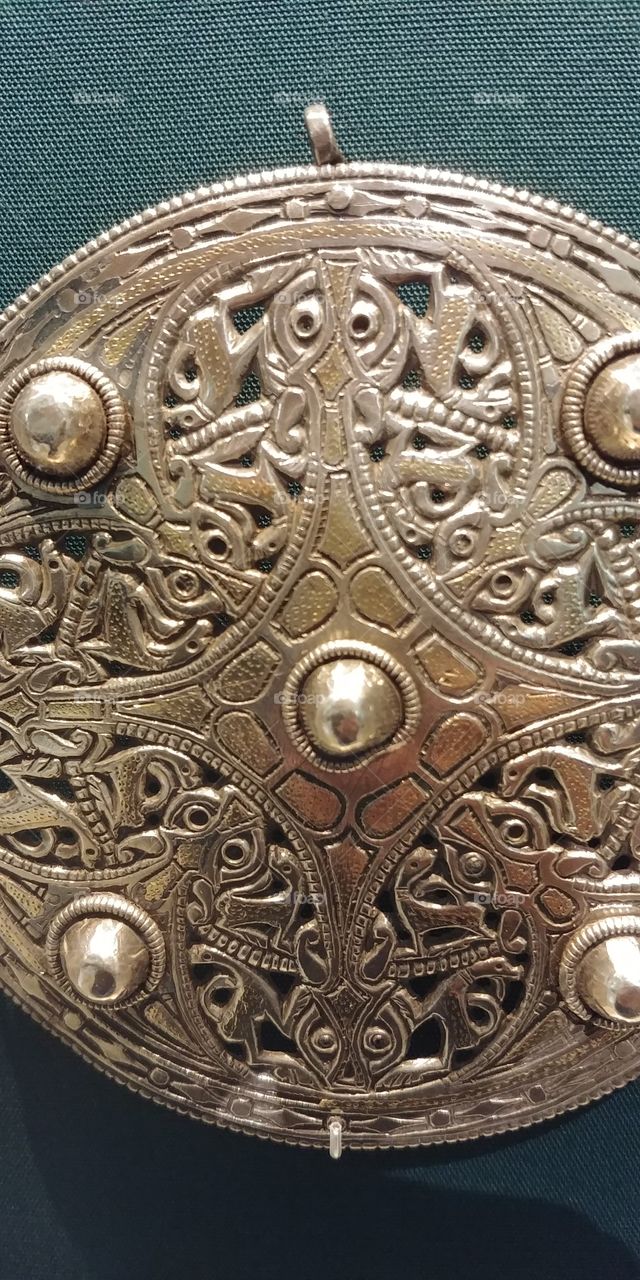 close up detail on medieval broach
