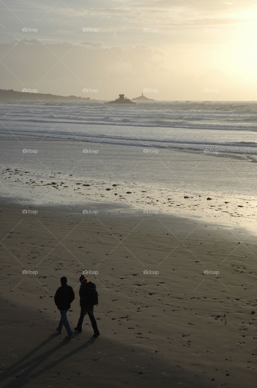 Tourist walking together on beach
