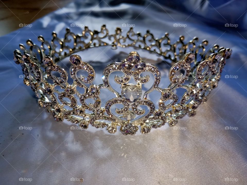 crown headdress with trinkets around it for a wedding