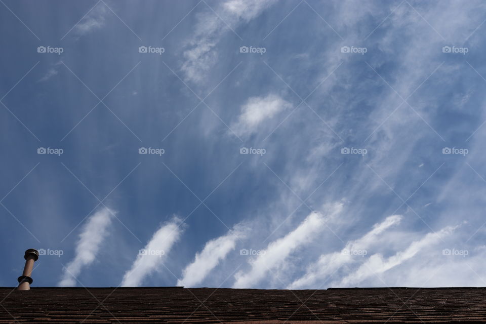 Clouds with a view on top of a roof!