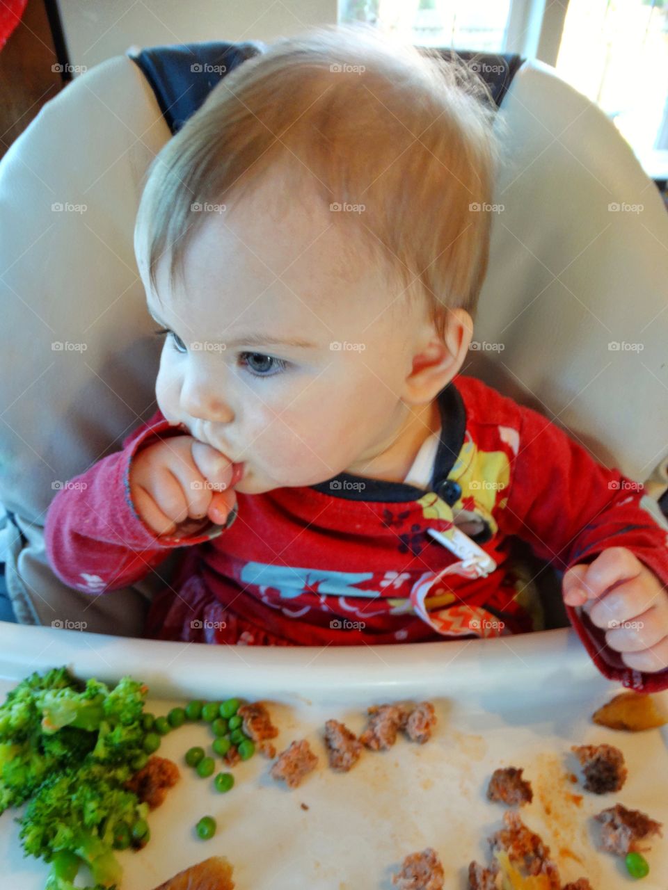 Baby In A Highchair