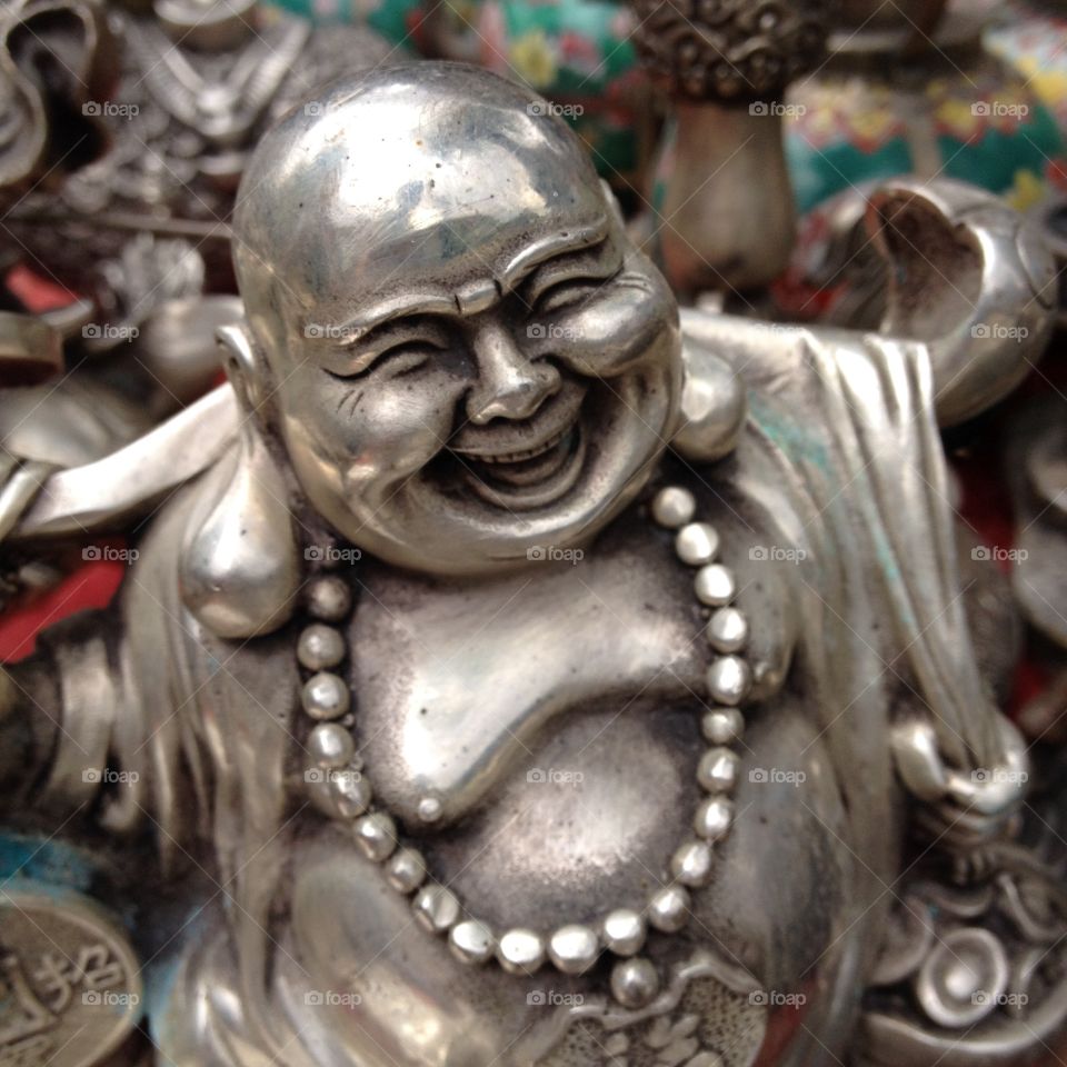 Happy Buddha Statue. Metal Happy Buddha Statue For Sale On Street Stall In China