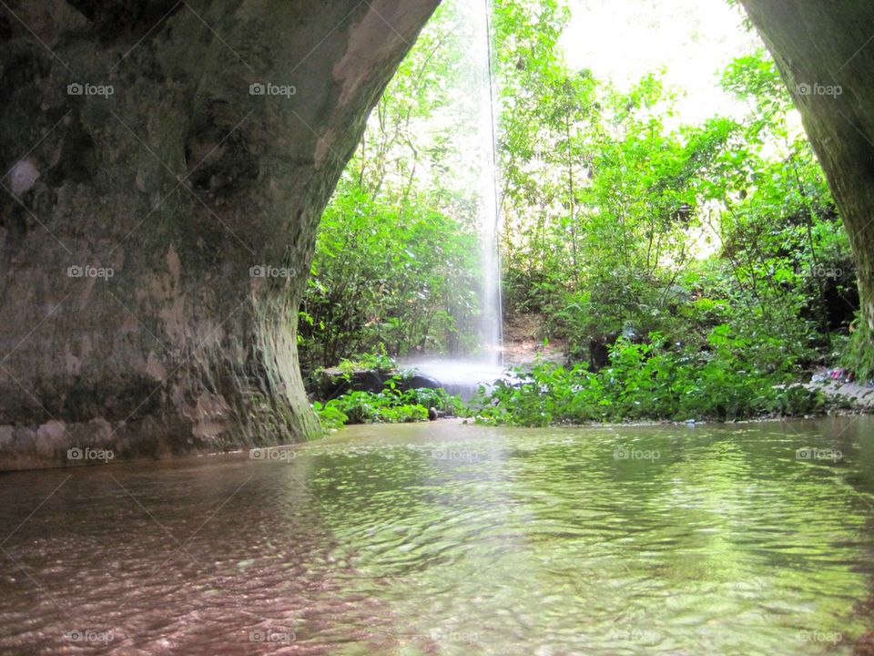 Waterfall cave in the amazon jungle 
