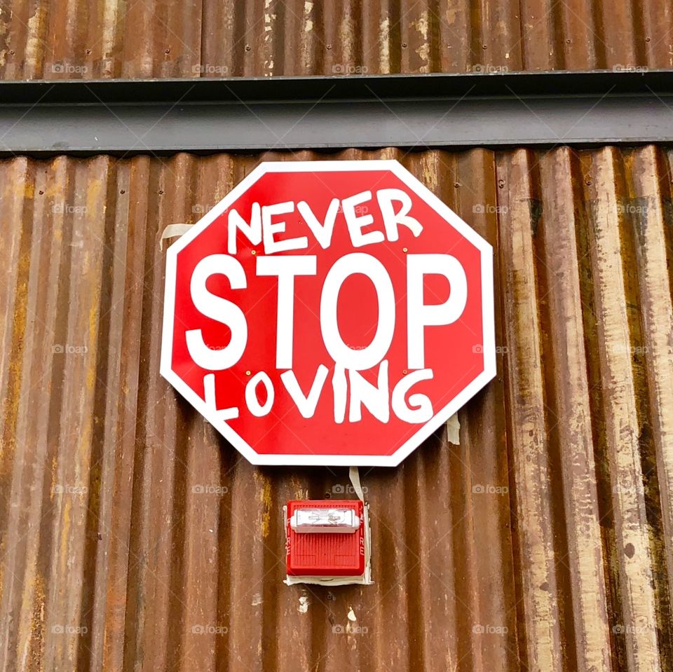 Never stop loving signboard
