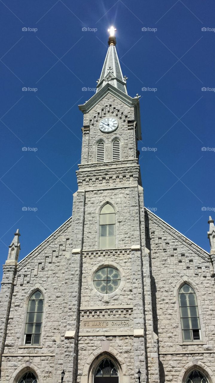 Historic Church. Sunlit Christian Cross