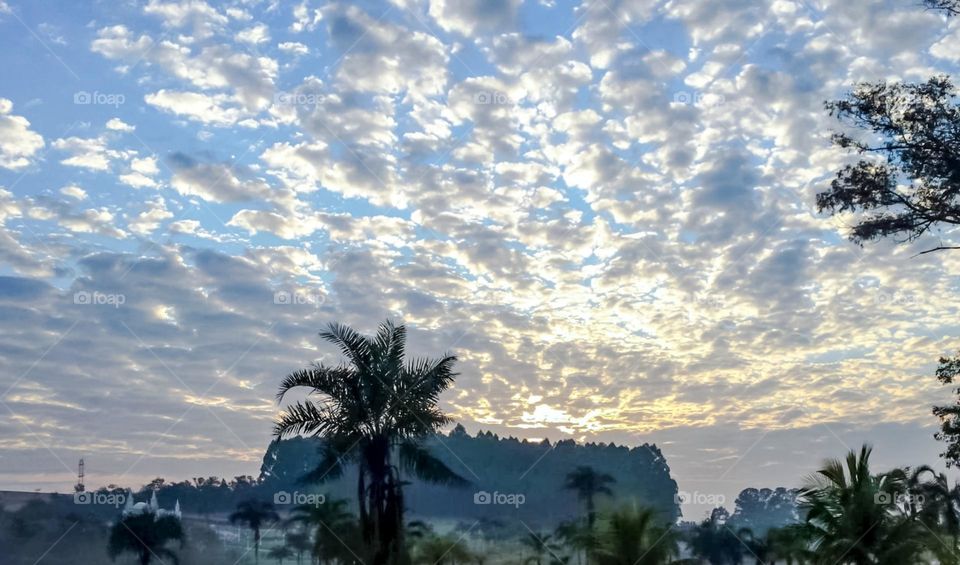 Beautiful sunrise between clouds on a cold morning.