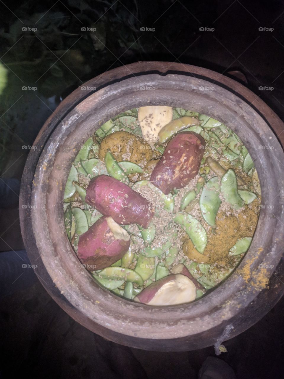 POPTI = VEGETABLES IN A CLAY POT, NATURALLY COOKED BY FIRE AROUND THE CLAY POT, TASTY AND YUMMY, mainly available during winter seasons in interior of Maharashtra state , India!