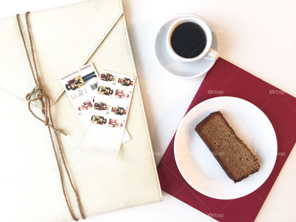 Bright desktop flat lay with coffee and bread cake