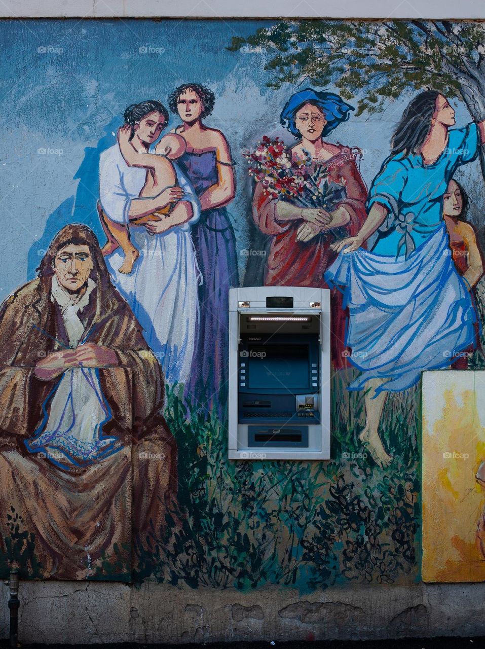 An ATM in the middle of a mural artistry in Orgosolo - Sardinia