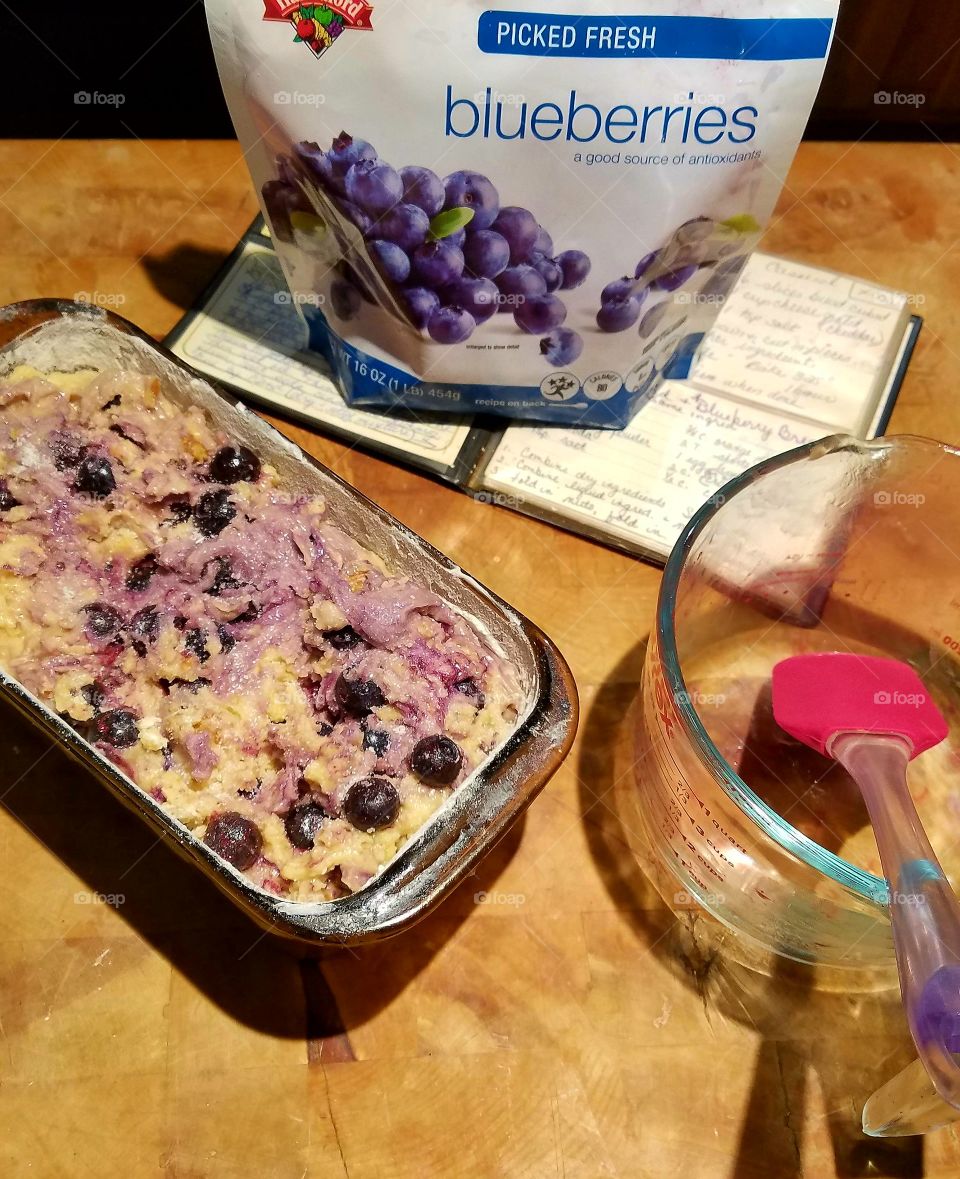 Making blueberry nut bread.