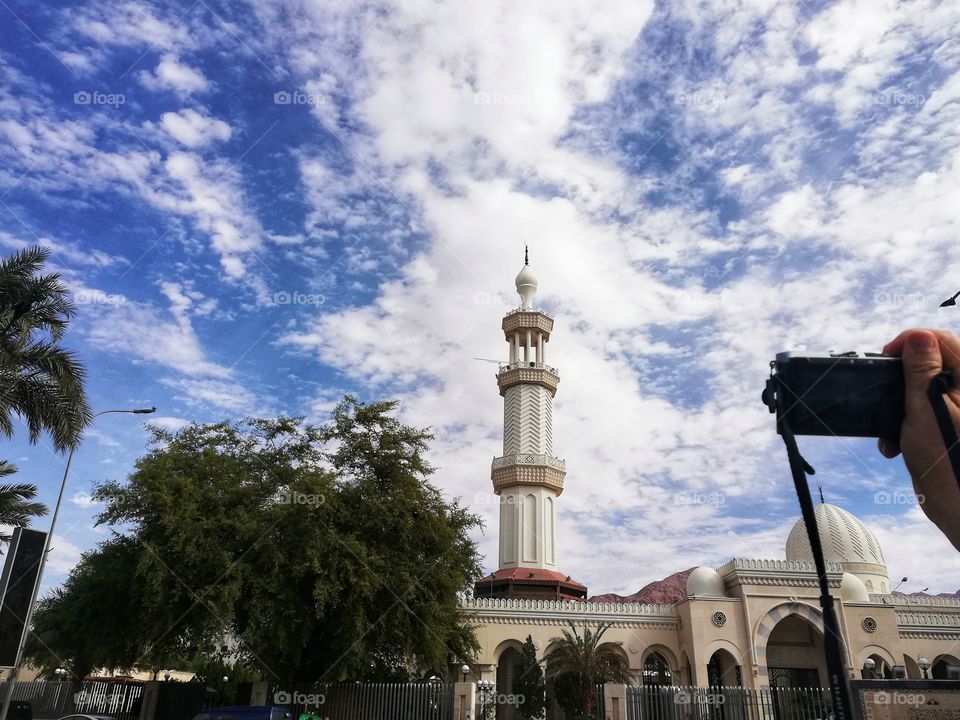 Tourist photographs Aqaba Mosque