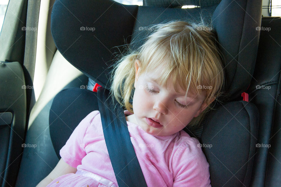 Sleeping child in car.