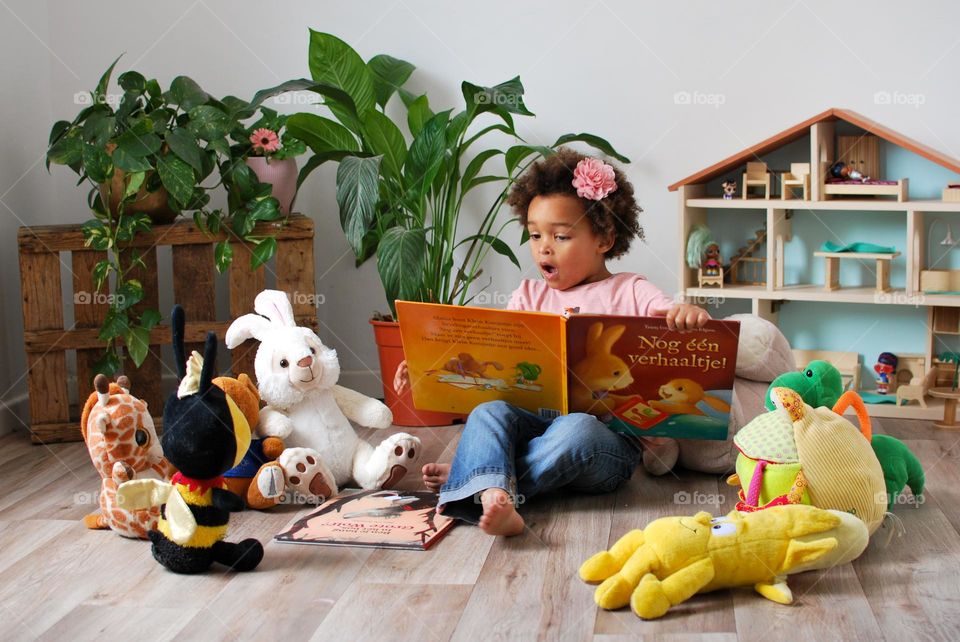 Girl Reading book and acting surprised