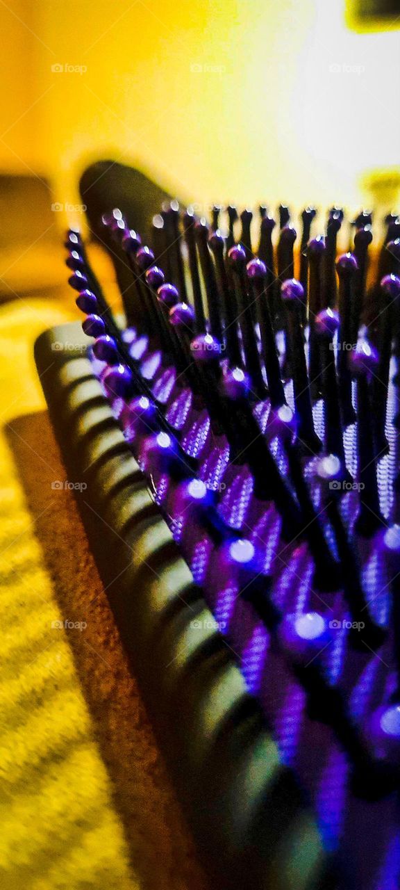 Purple bristle hairbrush.