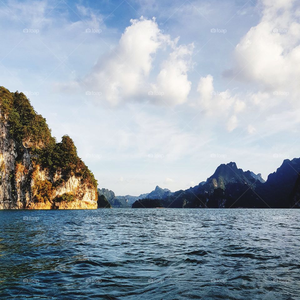 Scenic view of lake against blue sky