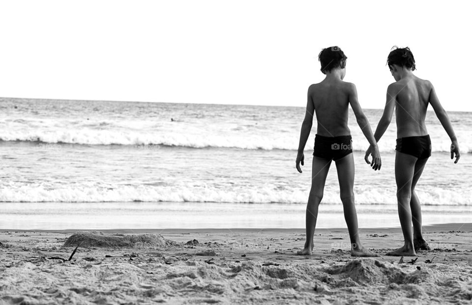 Two boys together at the beach