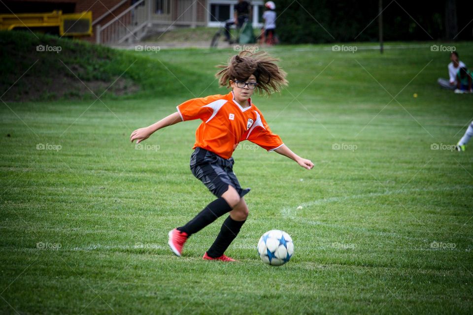 Soccer player is going to kick the ball