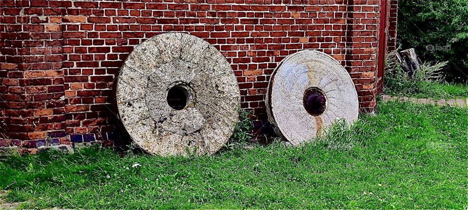 Two millstones outside the house let everyone know that this is or was at one point a windmill just in case you should have missed the giant blades. This is located in “Rostock” by the “Baltic Sea” in former “East Germany”. 2023. Hypnotic Productions