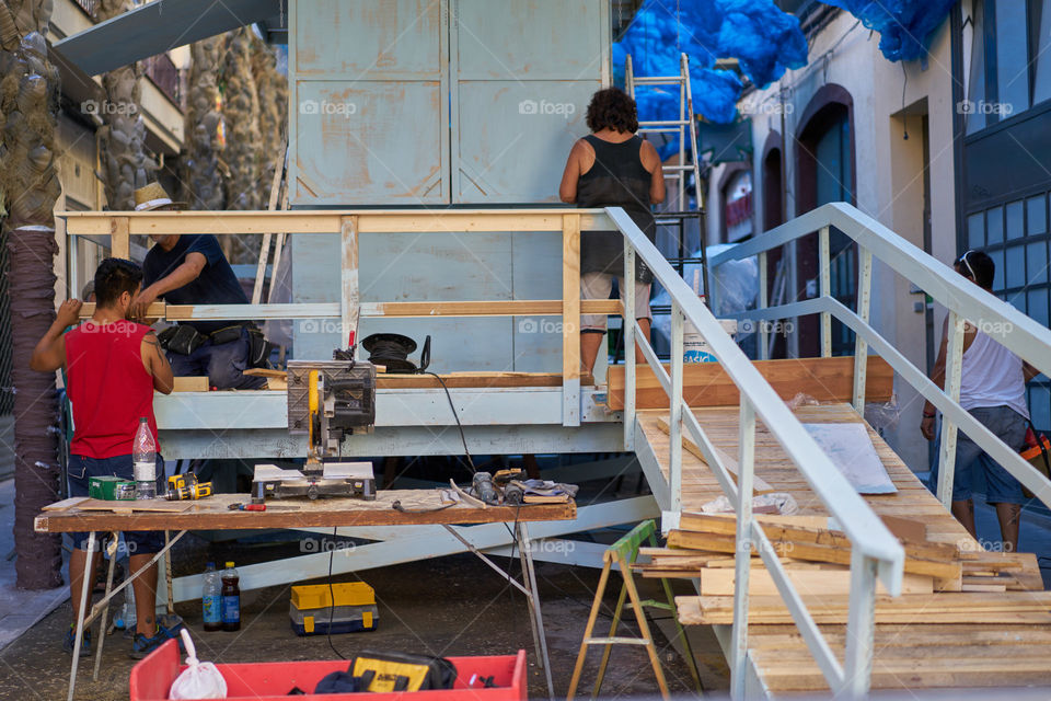 Building a Lifeguard platform in the streets of Gracia (Barcelona).  Popular fair.