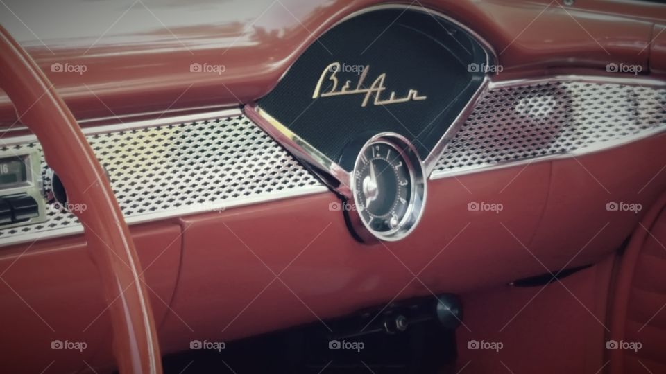 The dash of a classic 1950s red and white Bel Air