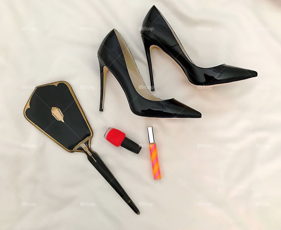 Fashion lay with black stilettos and cosmetics.