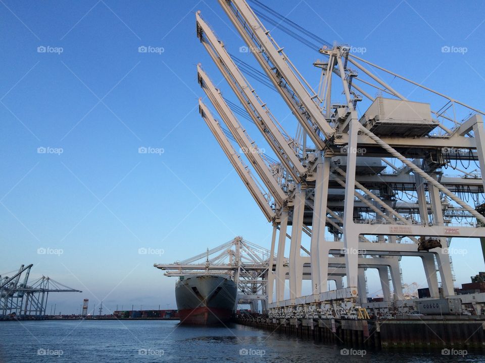 Port of Long Beach cargo ship and cranes 