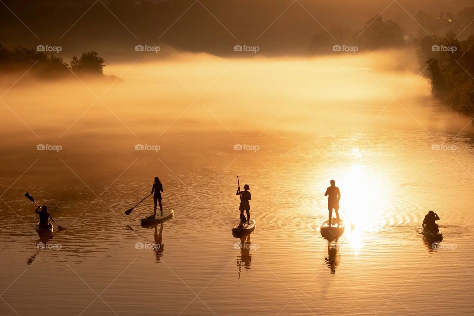 Water sports on foggy water