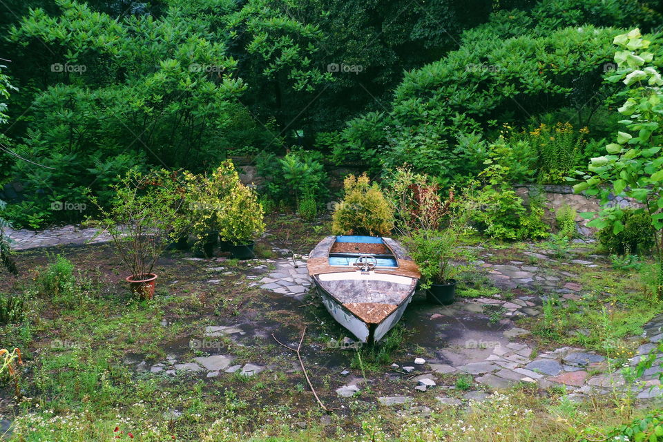 old boat in an abandoned pool