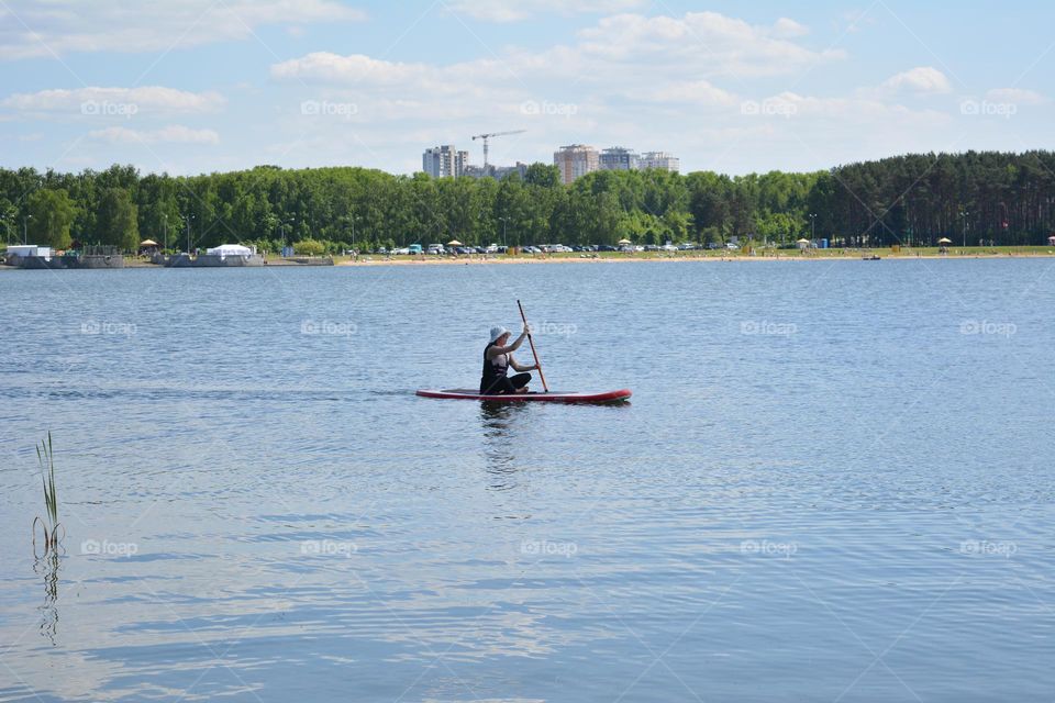 woman on a boat on a lake summer vacation