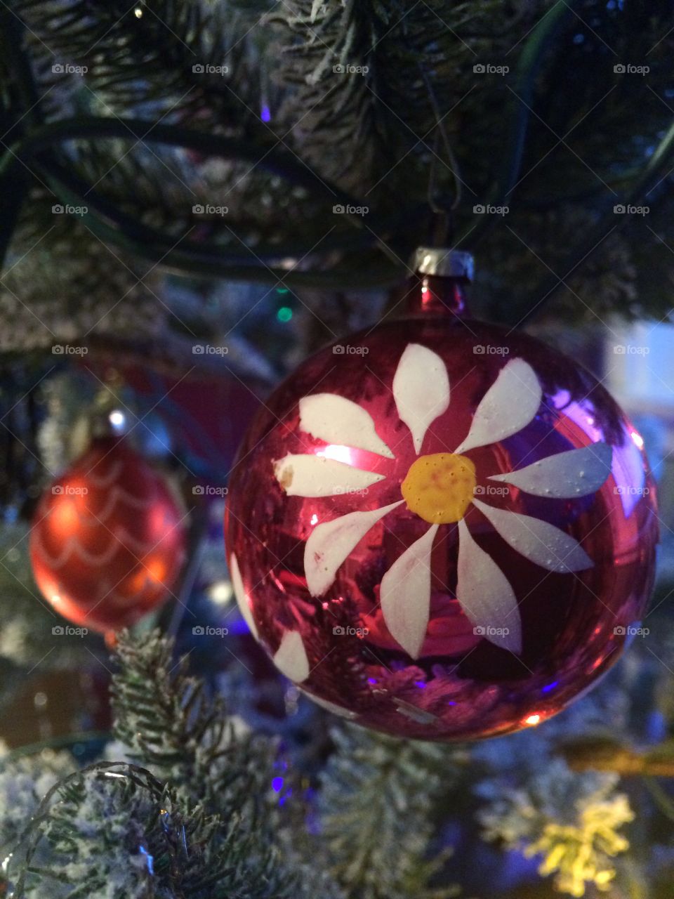 Pink vintage ornament hanging in a tree