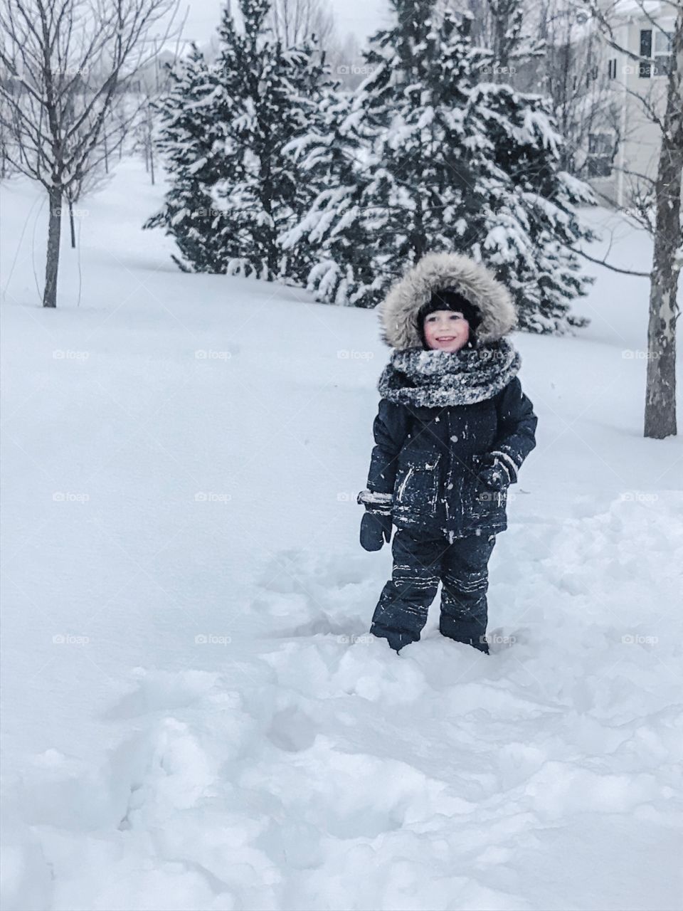 Boy playing in the snow