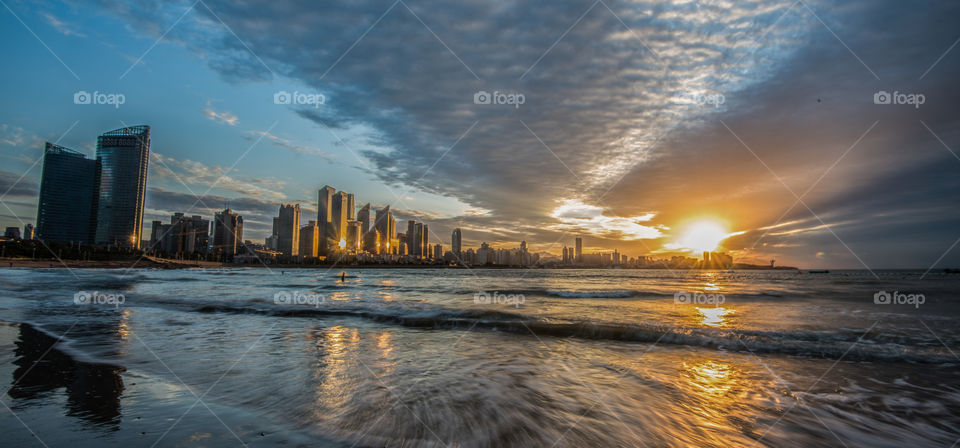 Asia China Qingdao sunrise downtown by the seaside sea with weaves old german colonies home of Tsingtao beer