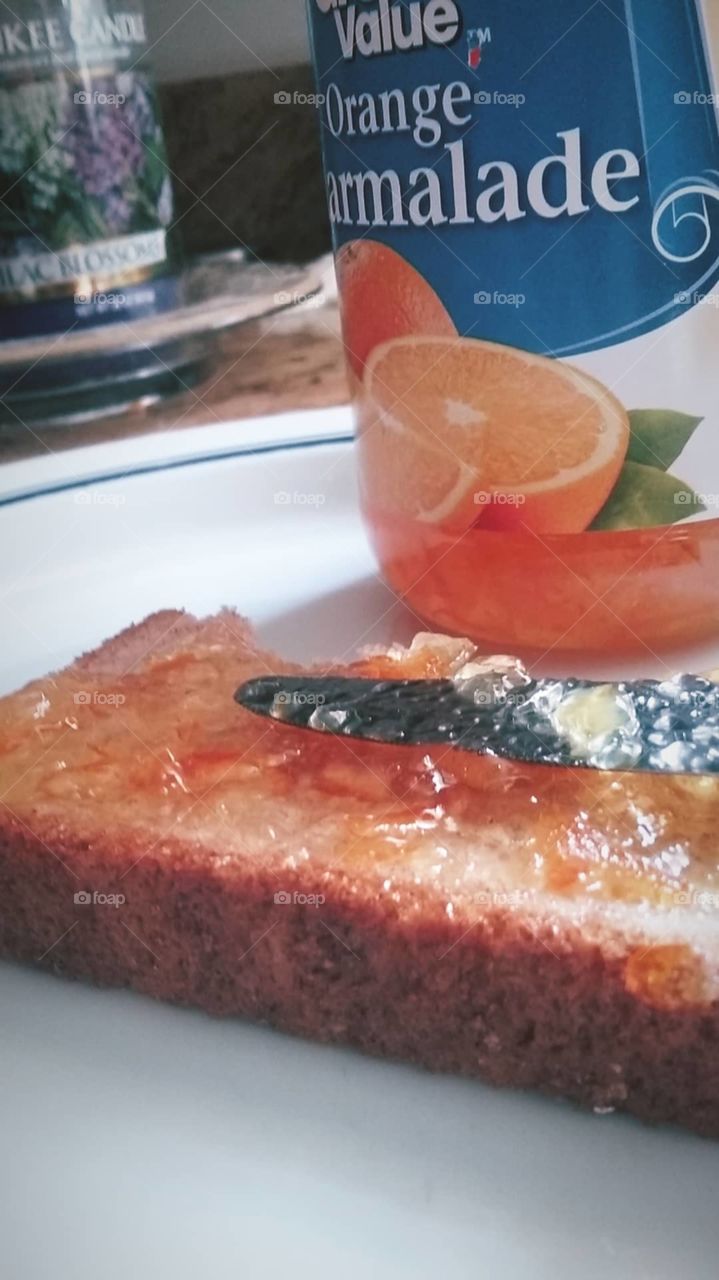 orange marmalade on toast for a midmorning snack