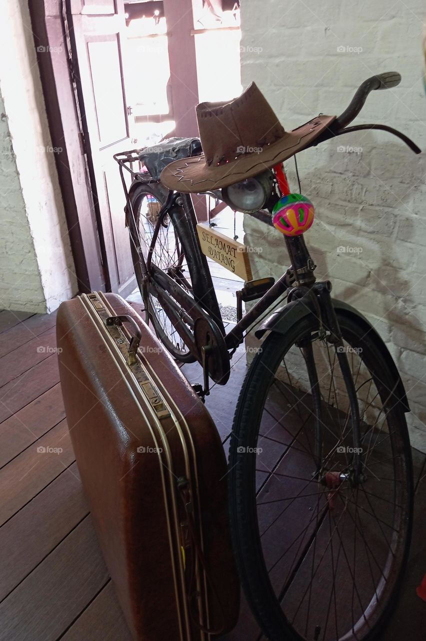 bicycle, suitcase and hat