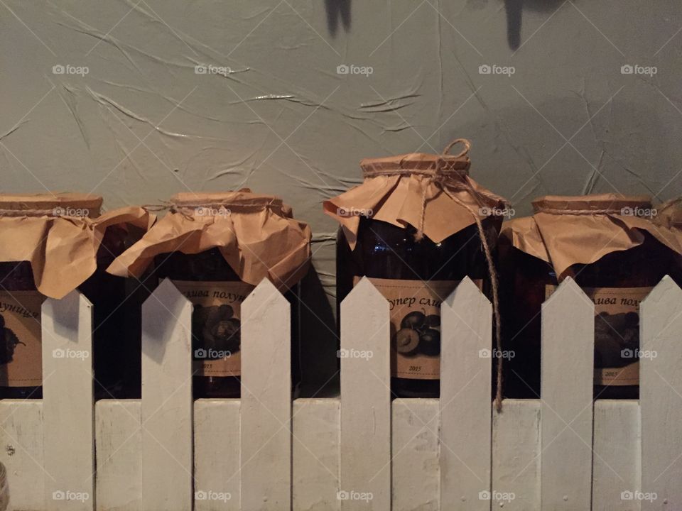 Pots with preserves on a shelf