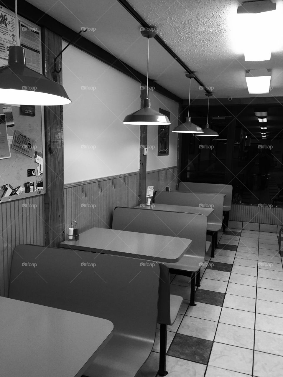 Black and white booths . Small restaurant in my hometown