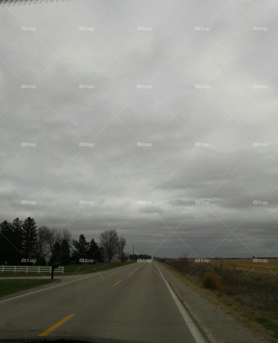 Empty road against sky