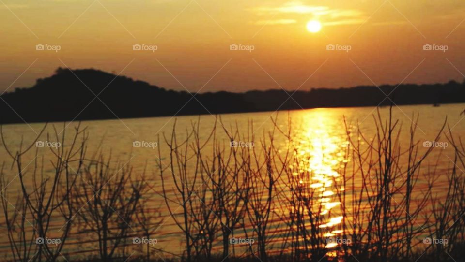 The sun at the end of the lake