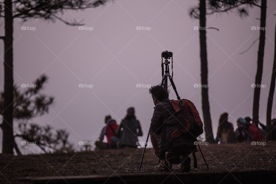 Photographer waiting for sunset 