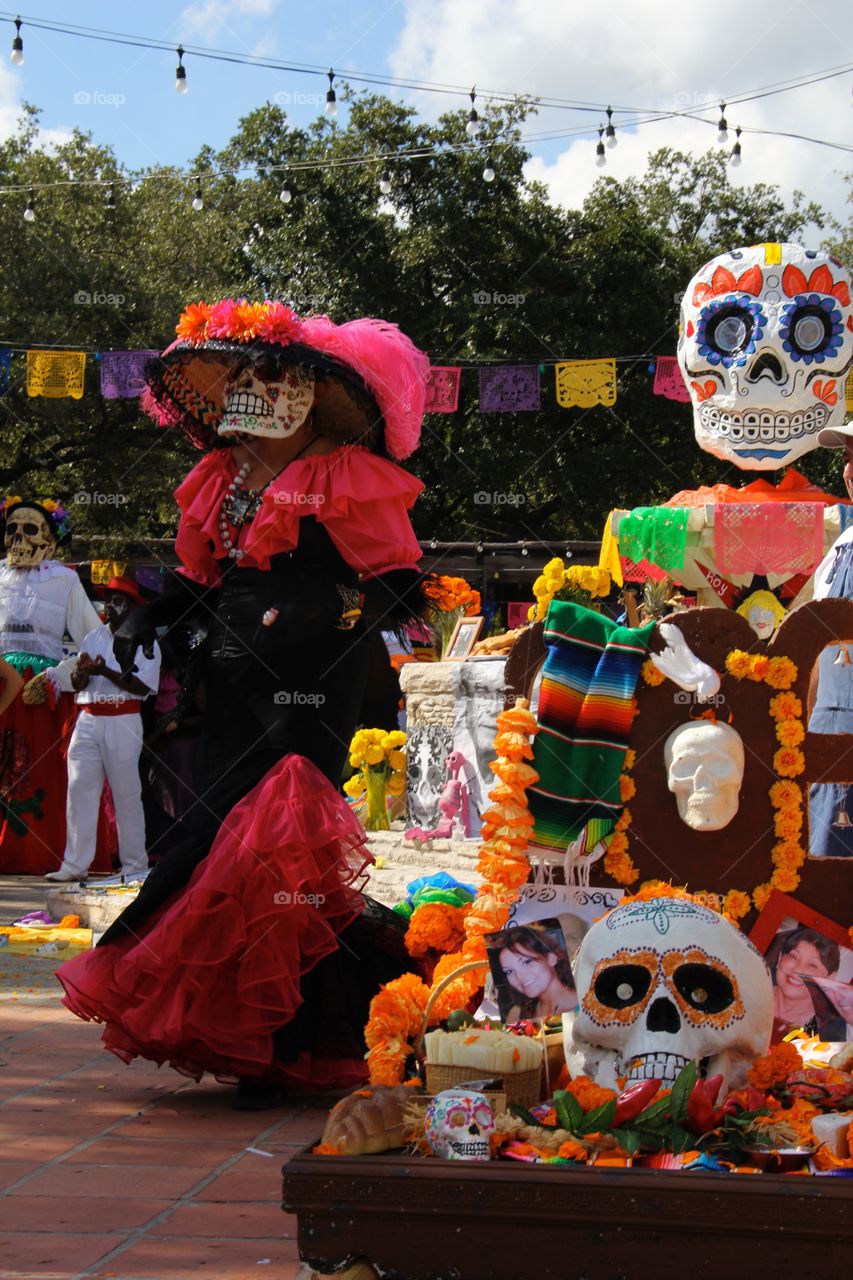A skeleton comes to life during the colorful, happy parade at San Antonio's Día de los Muertos festival. 