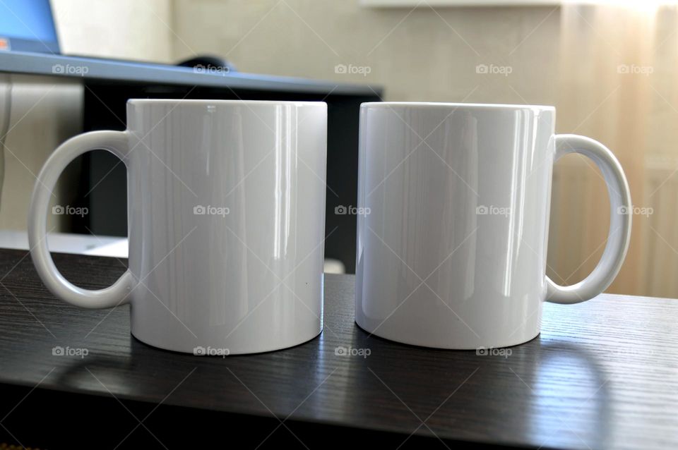 Two white ceramic cups for applying images and photos