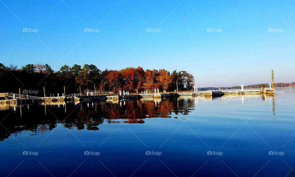 reflections of a dock during autumn