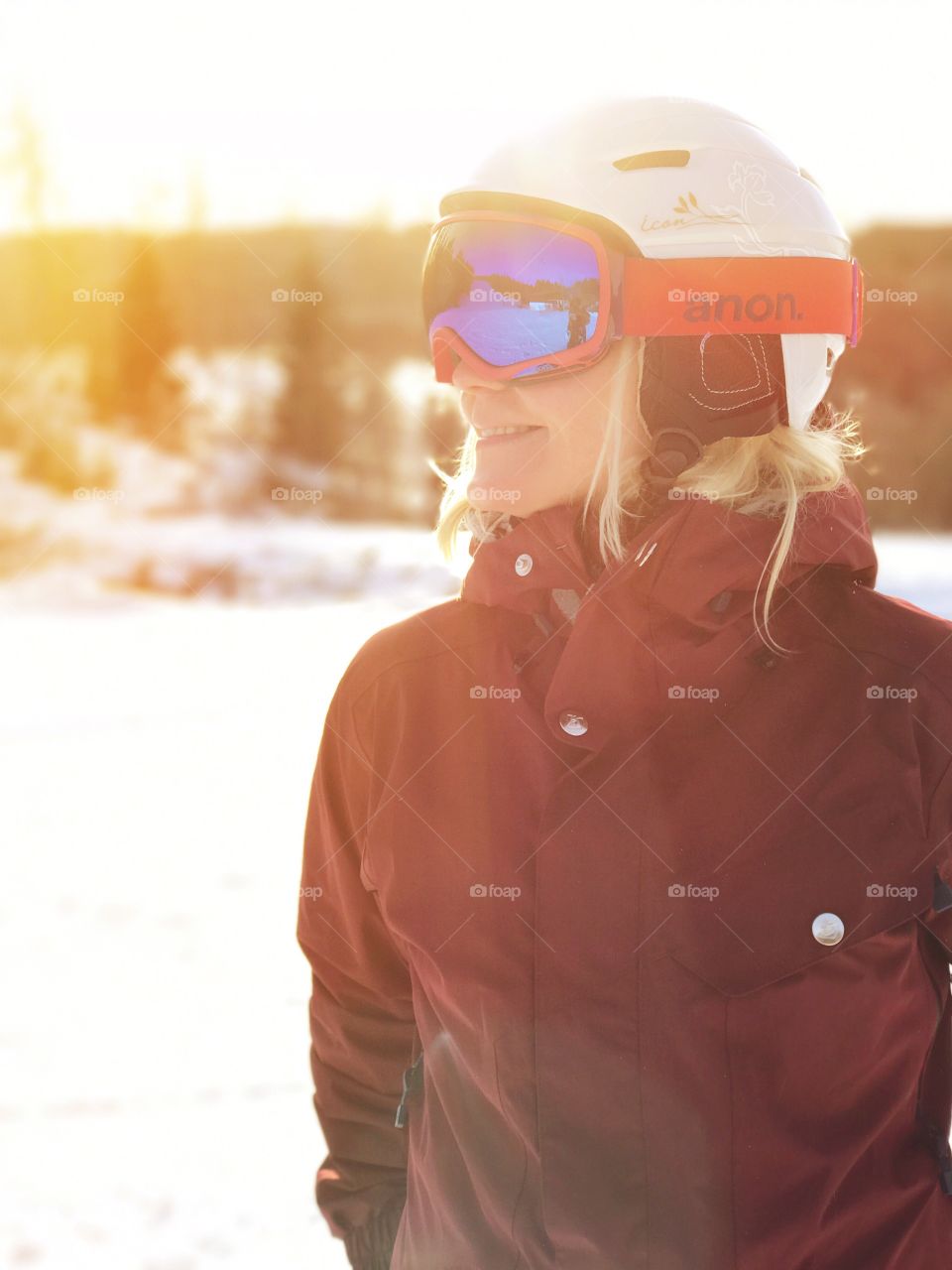 Smiling woman wearing ski goggles