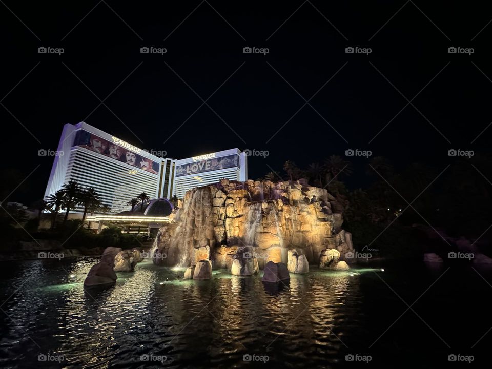 The Mirage stands out on the Las Vegas Strip because of its unusual gold facade. Also, palm trees and other tropical plants are among the lush landscape elements that complement the building’s clean, modern architecture and give the area a resort.